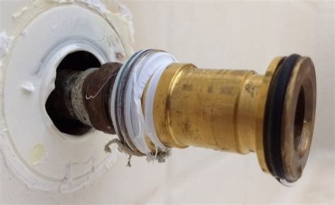 New bathtub diverter spout drains back into wall